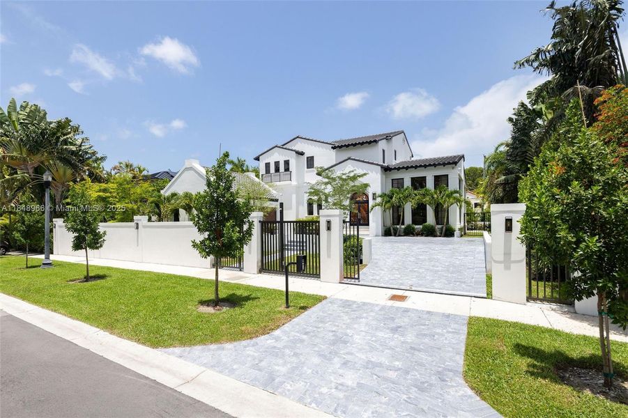 Front exterior of a new home in , Miami Beach, FL, highlighting curb appeal (Image 1). Front exterior of a new home in , Miami Beach, FL, highlighting curb appeal (Image 1).