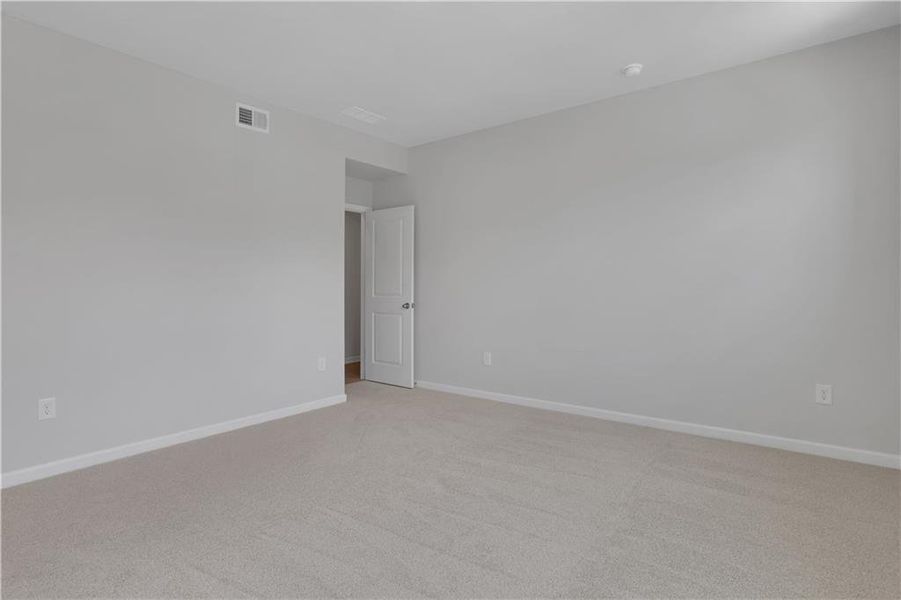 Spacious, unfurnished interior of a new home in The Paddocks at Doc Hughes, Buford (Image 37).