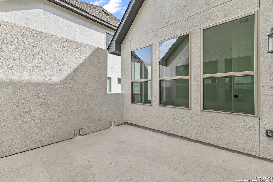 Exterior details and patio area of a home in Ventana, Bulverde (Image 21).