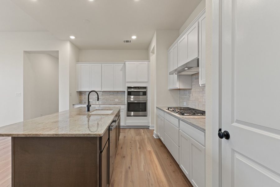 Representative furnished interior of a home built from the Waterville by Ashton Woods in The Trails at Carmel, Pflugerville (Image 8).