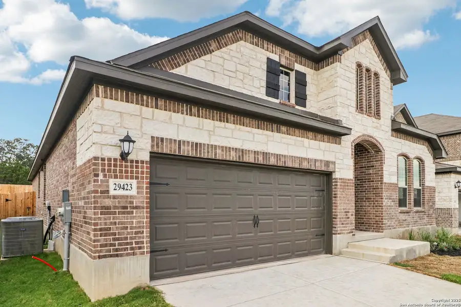 Front exterior of a new home in Fox Falls, Boerne, TX, highlighting curb appeal (Image 2).