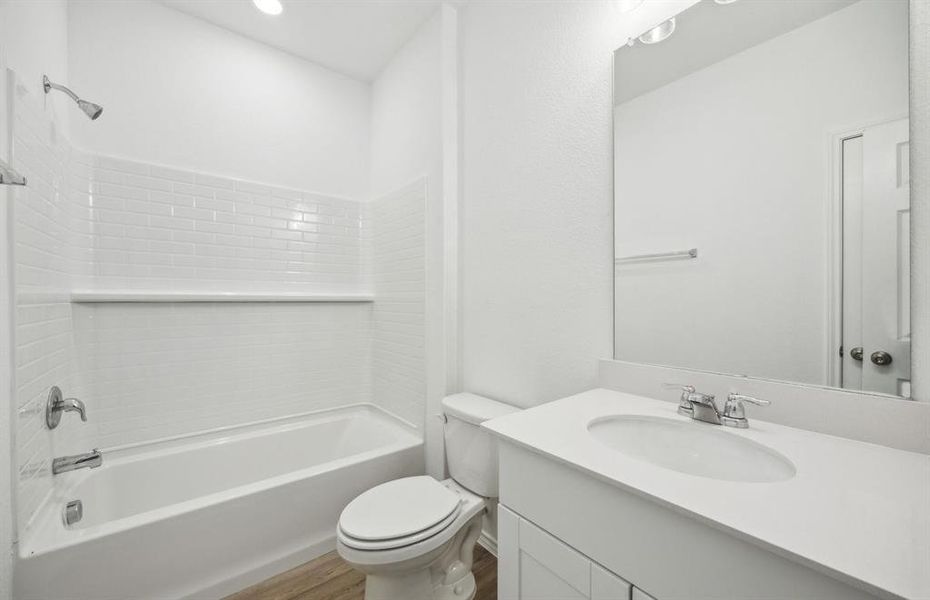 Secondary bathroom with upgraded fixtures *real home pictured