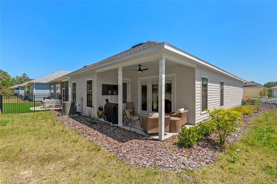Exterior details and patio area of a home in Fairway Pointe at West End, Newberry (Image 34).