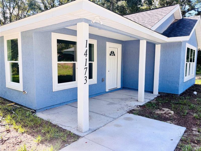 Front exterior of a new home in , Summerfield, FL, highlighting curb appeal (Image 17).