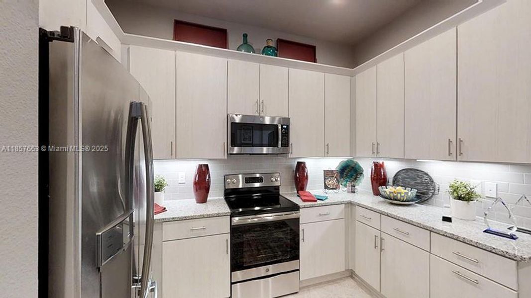 Furnished interior view inside a new home in Westlake Townhomes, Ormond Beach (Image 26).