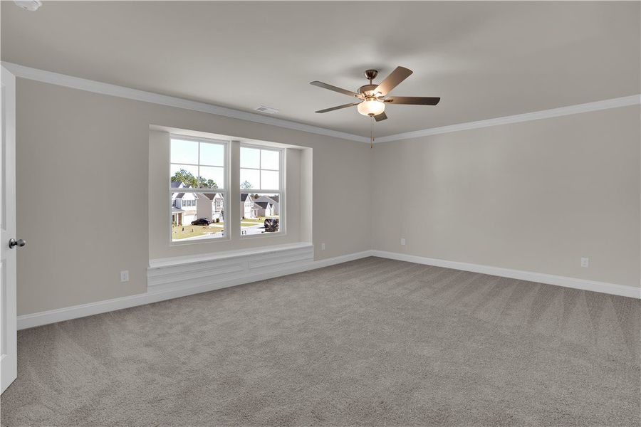 This spacious bedroom offers ample natural light a This spacious bedroom offers ample natural light a