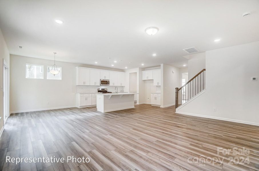 Spacious Family Room (will feature a cosmo fireplace with shiplap wall)