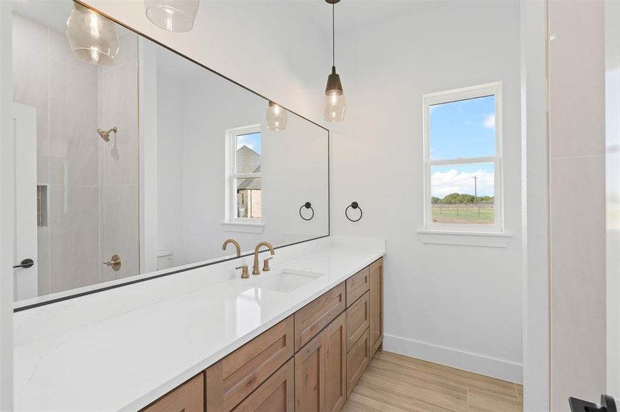 Bathroom featuring vanity and wood-type flooring