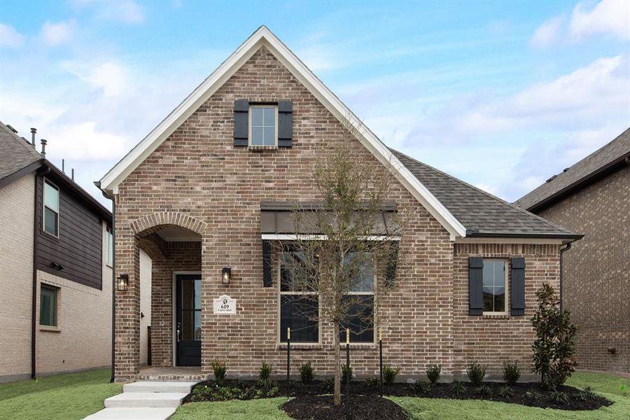 View of front of home with brick siding, roof with shingles, and a front yard View of front of home with brick siding, roof with shingles, and a front yard