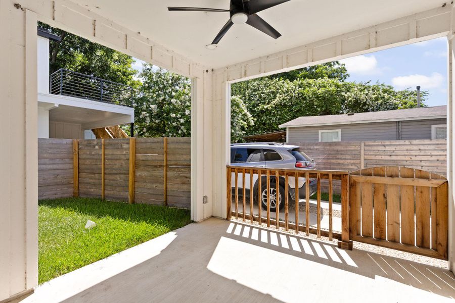 An inviting covered patio offers a private outdoor retreat, perfect for enjoying peaceful moments.