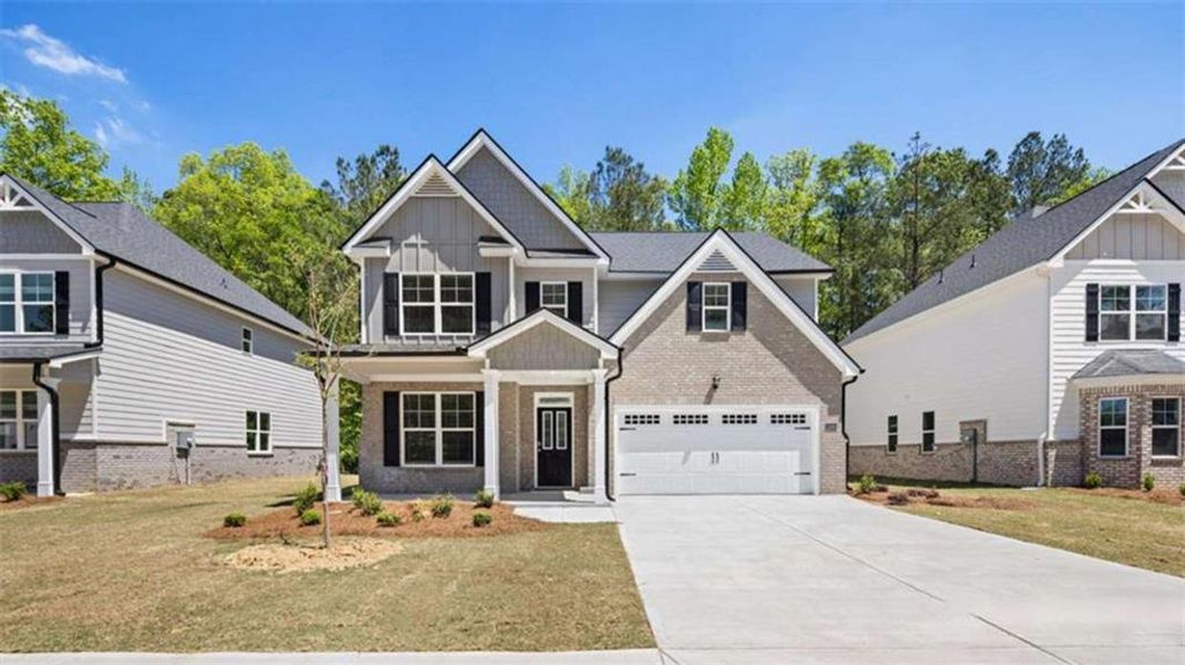Front exterior of a new home in Wildwood, Covington, GA, highlighting curb appeal (Image 2).