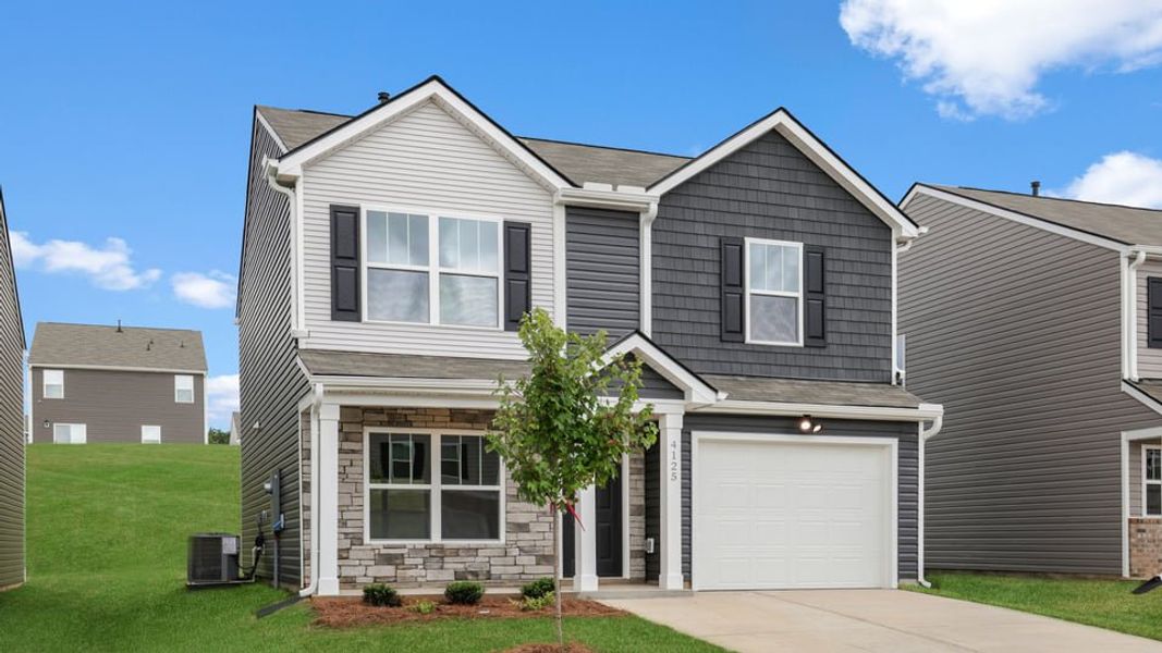 Front exterior of a new home in Baxter Village, Boiling Springs, SC, highlighting curb appeal (Image 2). Front exterior of a new home in Baxter Village, Boiling Springs, SC, highlighting curb appeal (Image 2).