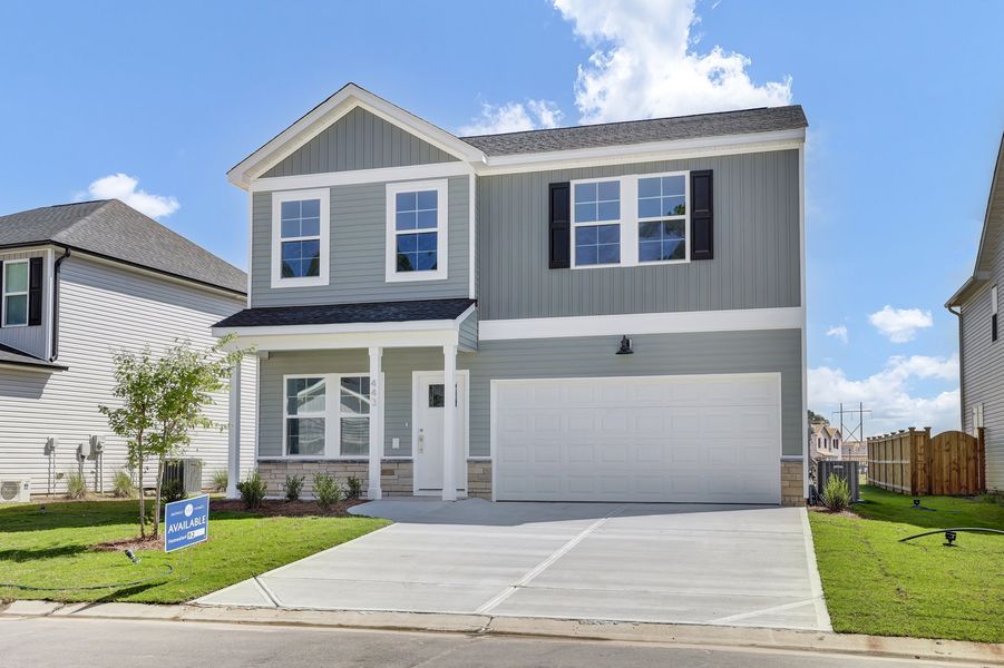 Front exterior of a new home in River Tide Farms, Bolivia, NC, highlighting curb appeal (Image 1). Front exterior of a new home in River Tide Farms, Bolivia, NC, highlighting curb appeal (Image 1).