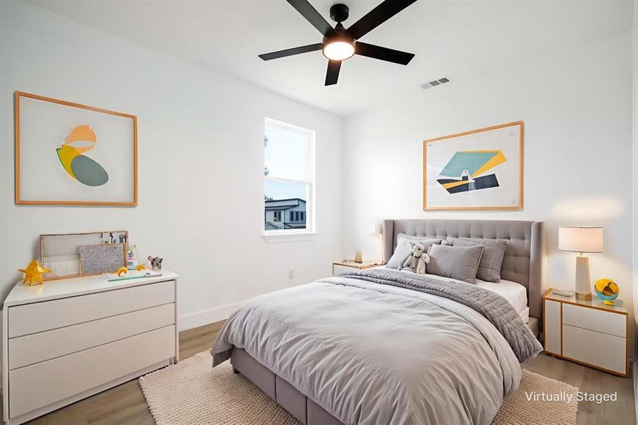 Bedroom featuring light wood-style floors and ceiling fan