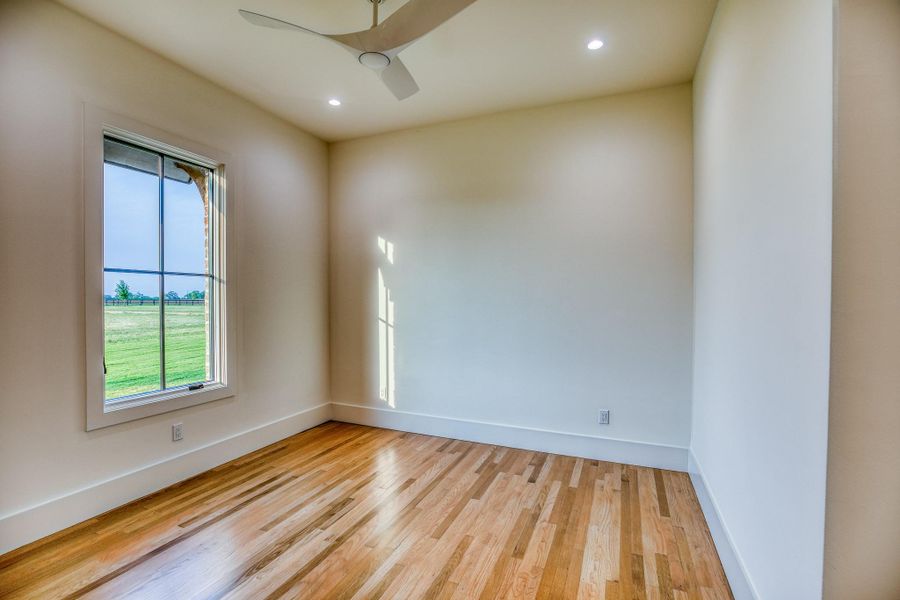 Empty room with light wood finished floors, recessed lighting, and a ceiling fan Empty room with light wood finished floors, recessed lighting, and a ceiling fan