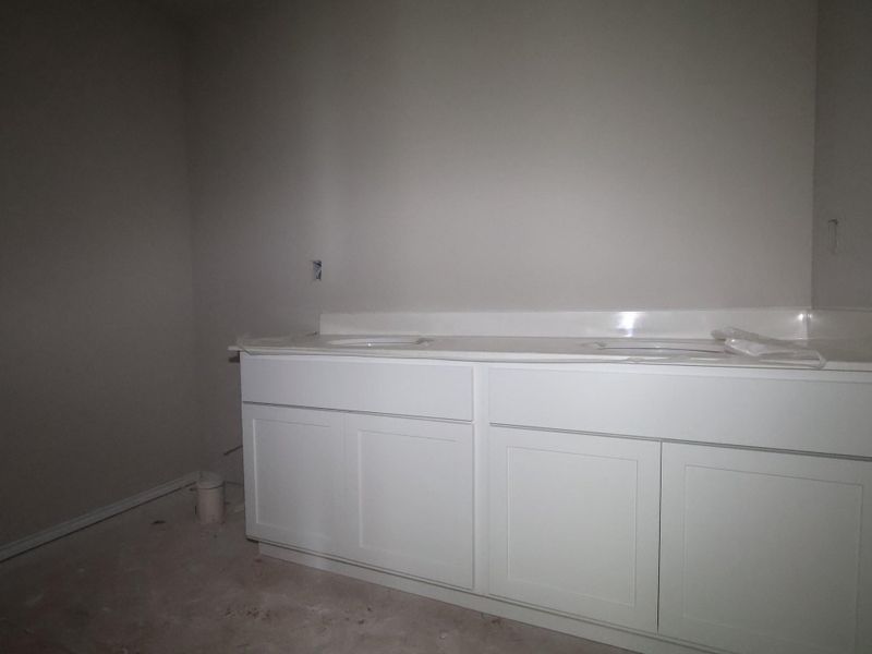 In-progress construction of a new home in Carillon, Manor, TX (Image 21).