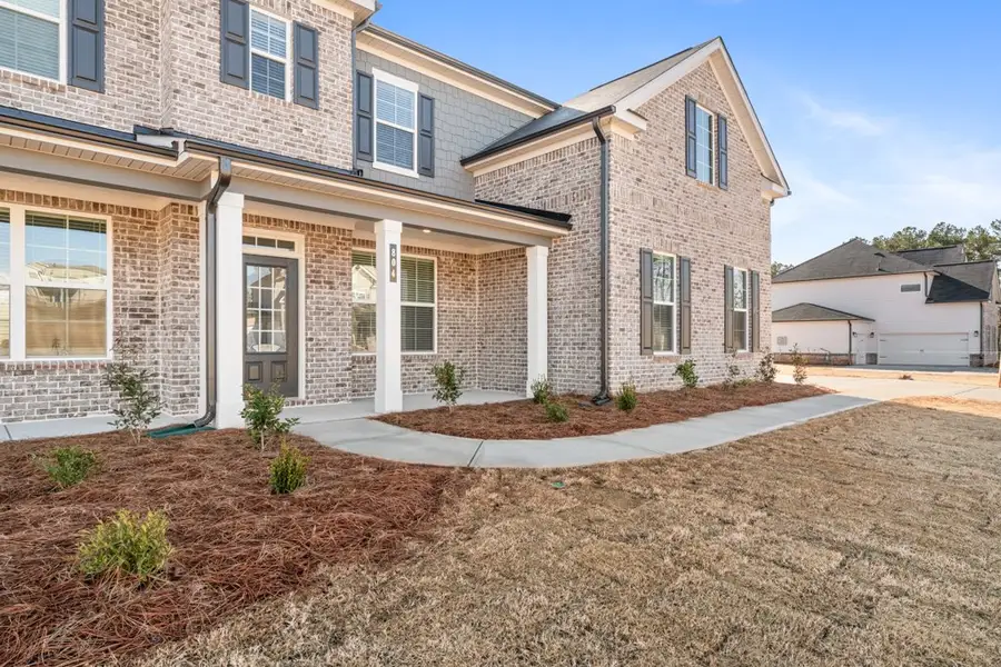 A brick building with a driveway. A brick building with a driveway.