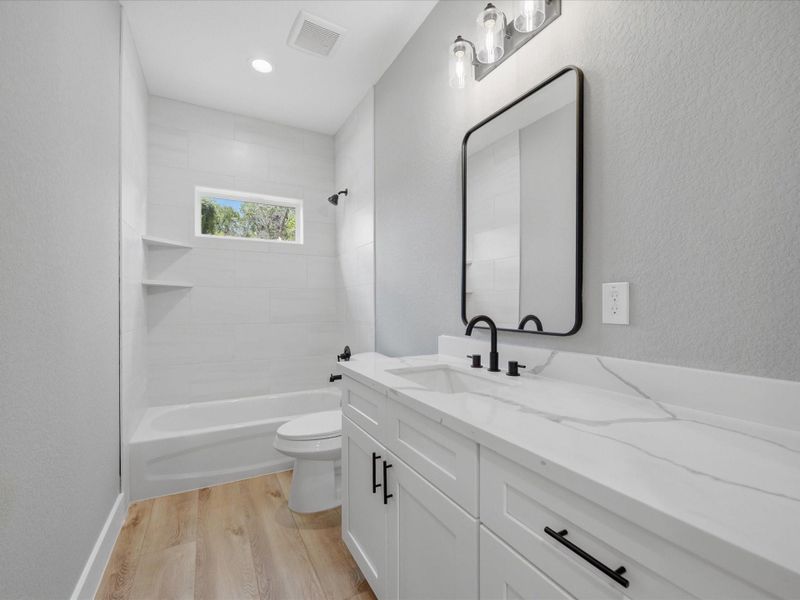 Serving the secondary bedrooms, the spacious full bath features modern finishes and a functional layout designed for daily convenience. Serving the secondary bedrooms, the spacious full bath features modern finishes and a functional layout designed for daily convenience.