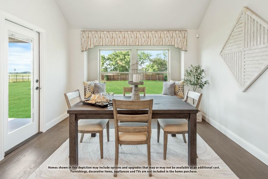 Dining area with wood table, chairs, hardwood floors, and large windows overlooking a backyard Dining area with wood table, chairs, hardwood floors, and large windows overlooking a backyard