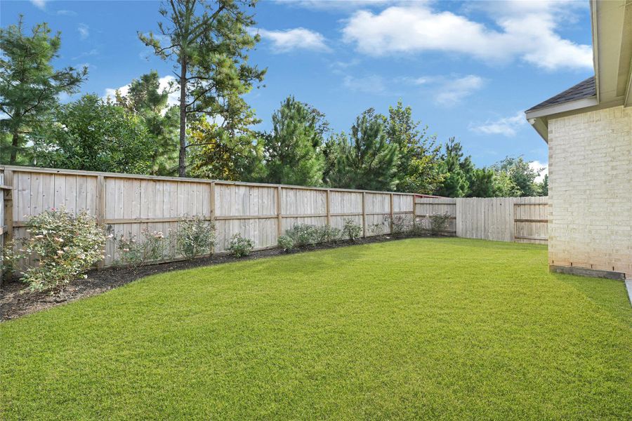 Front exterior of a new home in Grand Central Park 45', Conroe, TX, highlighting curb appeal (Image 1). Front exterior of a new home in Grand Central Park 45', Conroe, TX, highlighting curb appeal (Image 1).