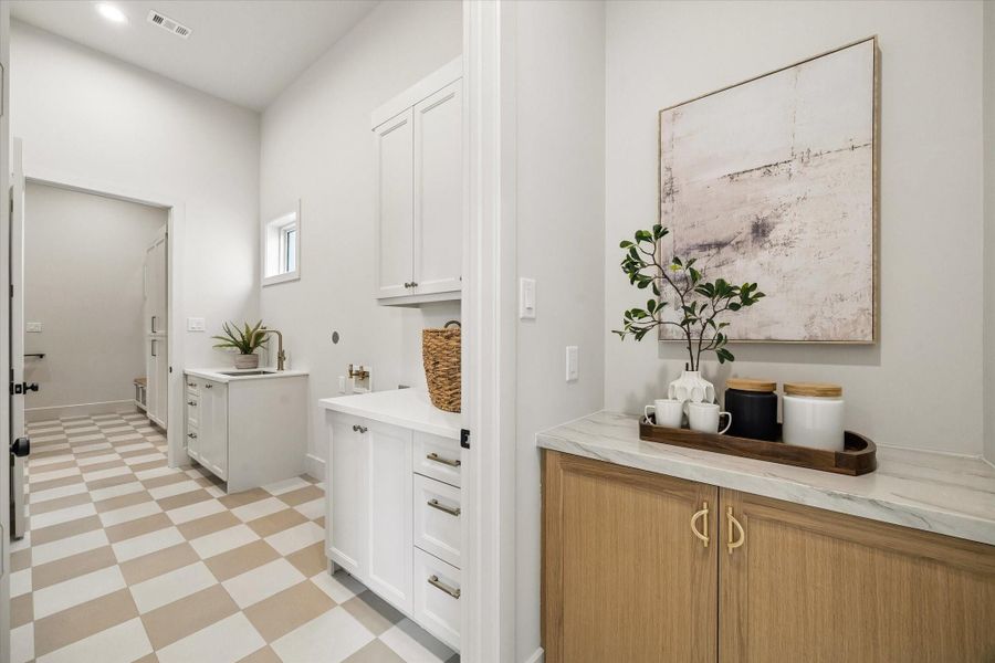 The utility room offers excellent everyday function with a natural flow into the mud room, keeping storage, laundry, and daily drop-zone needs neatly organized. The utility room offers excellent everyday function with a natural flow into the mud room, keeping storage, laundry, and daily drop-zone needs neatly organized.