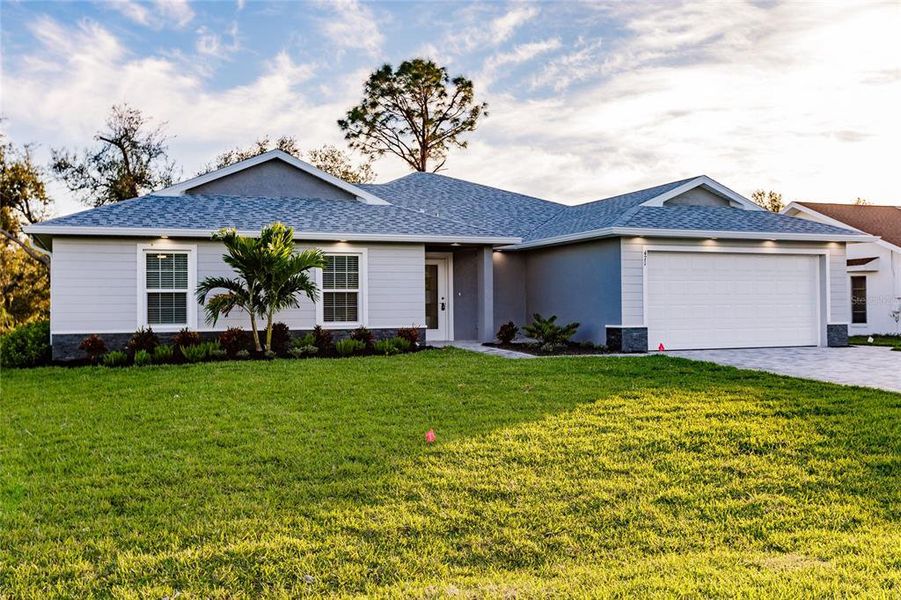 Front exterior of a new home in , Cape Coral, FL, highlighting curb appeal (Image 15).