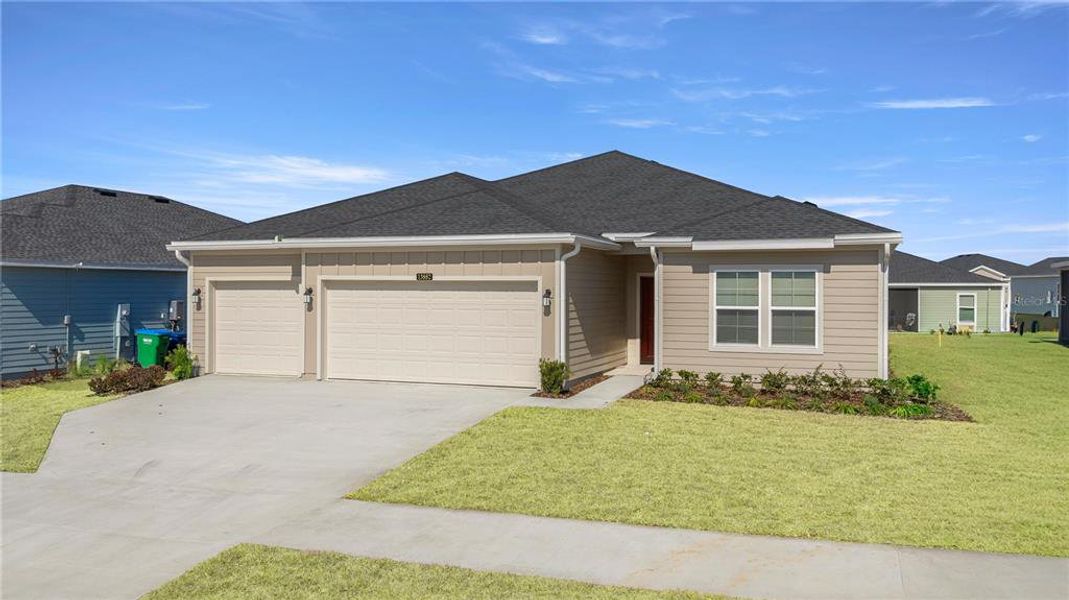 Front exterior of a new home in Pioneer Ranch, Ocala, FL, highlighting curb appeal (Image 2).