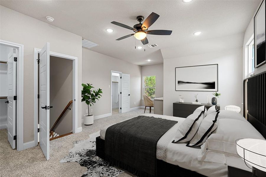 Carpeted bedroom featuring ceiling fan