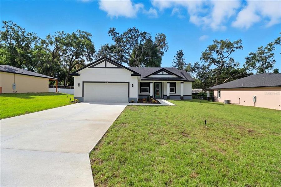Front exterior of a new home in , Inverness, FL, highlighting curb appeal (Image 23).
