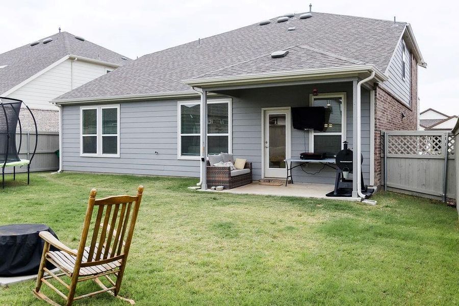 Exterior details and patio area of a home in Pecan Square, Northlake (Image 21).