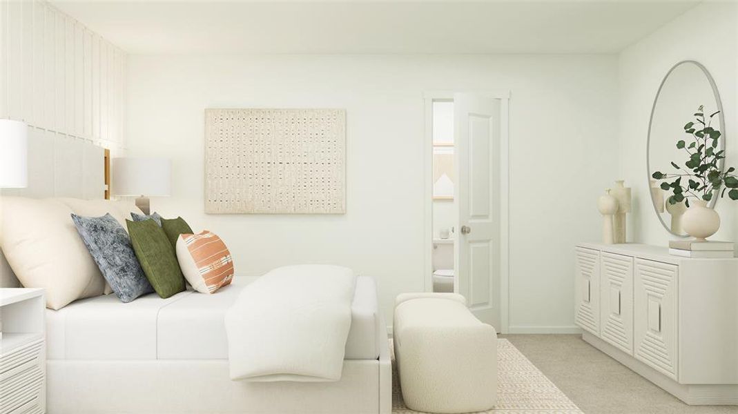 Bedroom with ensuite bathroom and light colored carpet