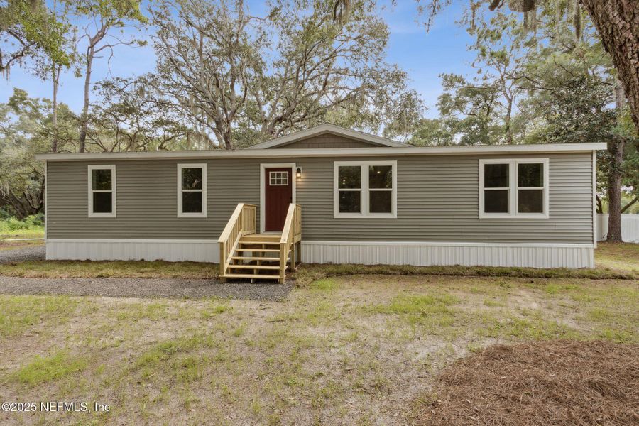 Front exterior of a new home in , Yulee, FL, highlighting curb appeal (Image 25).