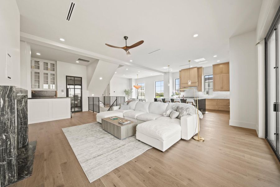 On the second floor, you are immediately greeted by the open concept dining, living, and kitchen space.