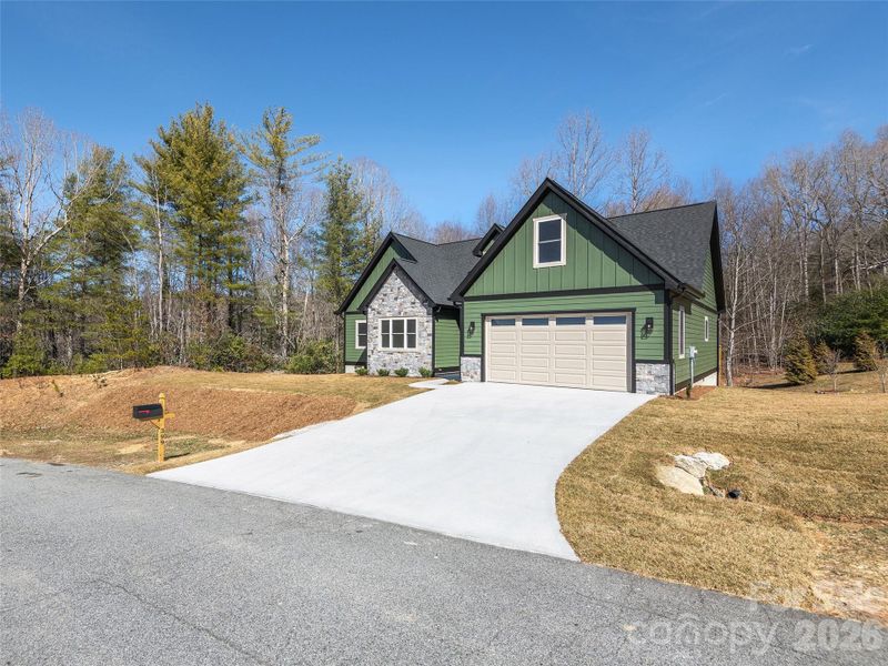 Front exterior of a new home in , Hendersonville, NC, highlighting curb appeal (Image 15).