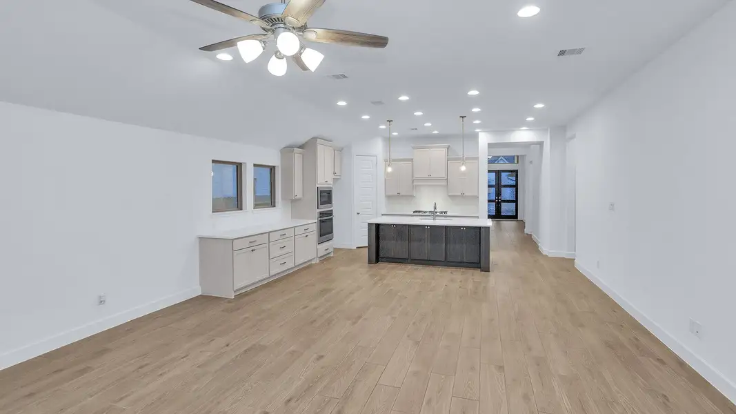 Furnished interior view inside a new home in Grand Central Park, Conroe (Image 4).