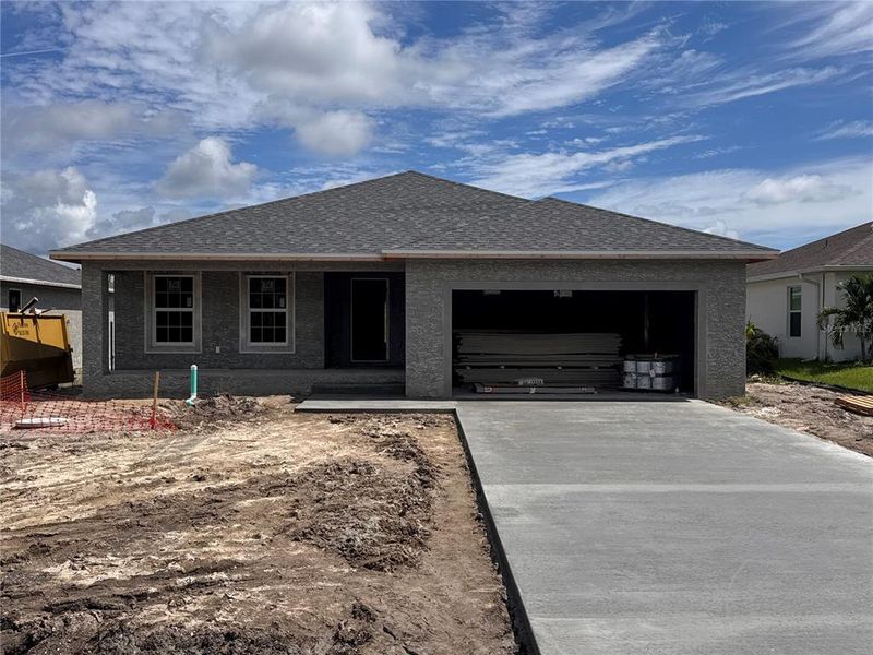 Front exterior of a new home in , Rotonda West, FL, highlighting curb appeal (Image 1). Front exterior of a new home in , Rotonda West, FL, highlighting curb appeal (Image 1).