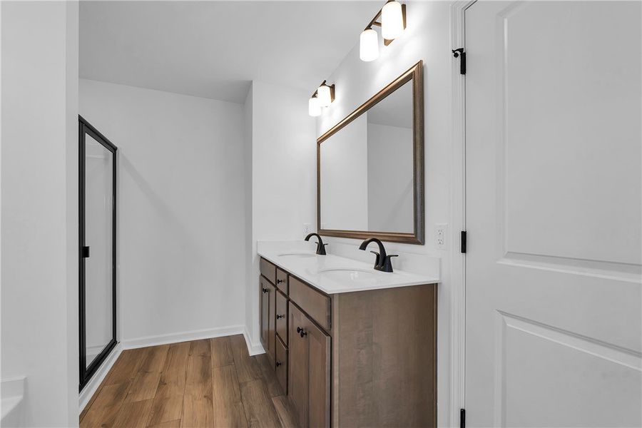 This spacious bathroom features a double vanity an