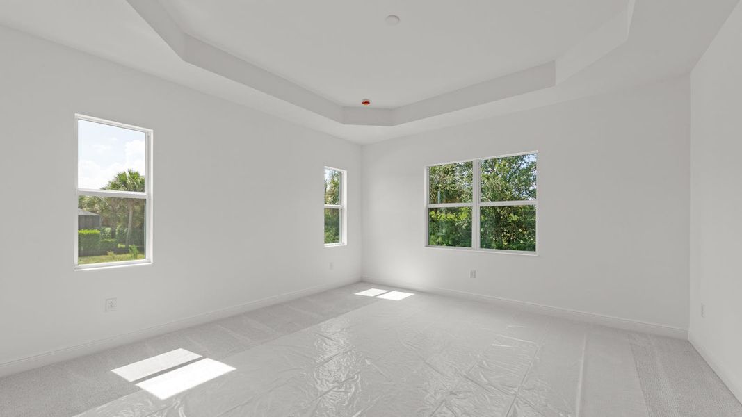 Spacious, unfurnished interior of a new home in Verandah Real Estate and Homes for Sale in Fort Myers, FL - Neal Communities, Fort Myers (Image 26).