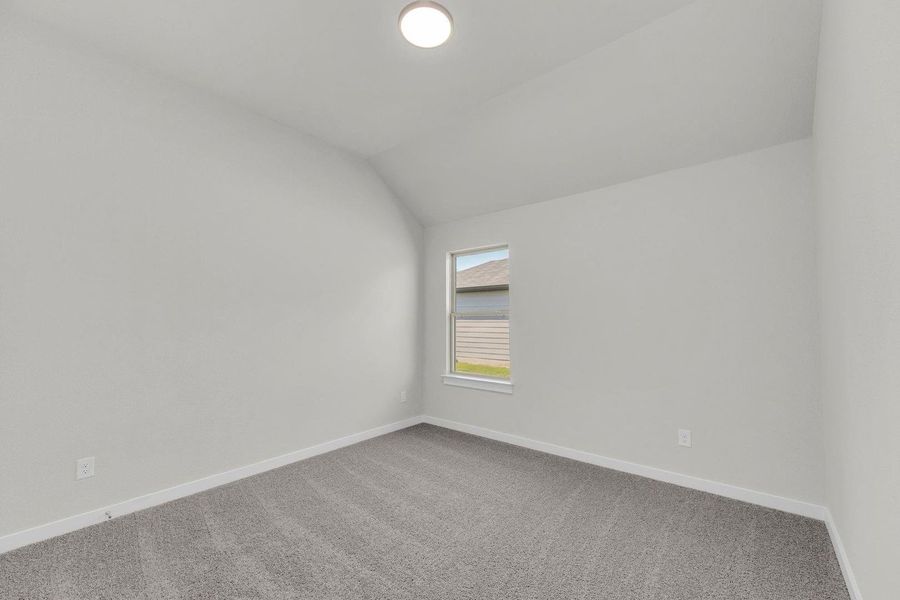 Bedroom in the Pecos home plan by Trophy Signature Homes – REPRESENTATIVE PHOTO