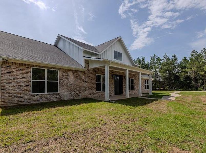 Front exterior of a new home in , Willis, TX, highlighting curb appeal (Image 28). Front exterior of a new home in , Willis, TX, highlighting curb appeal (Image 28).
