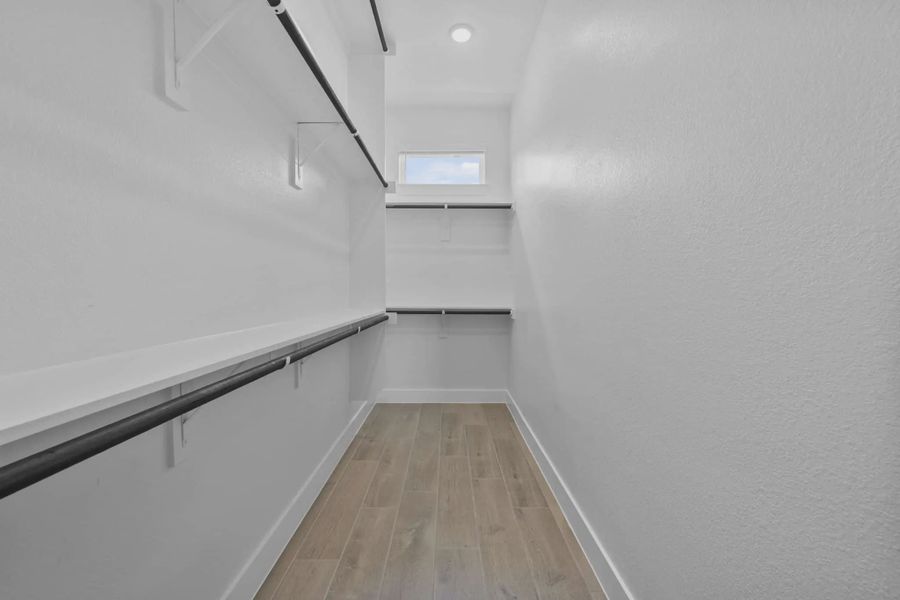 Representative unfurnished interior of a home built from the Versailles by Chesmar Homes in Meridiana Chateau, Manvel (Image 43).