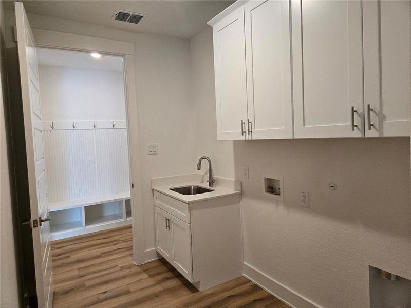 You will love the spacious utility room offering a second sink and great storage!