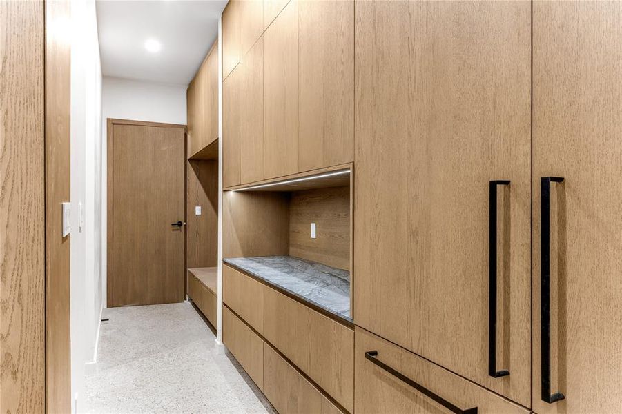 Close up of refrigerator, counter and mudroom views
