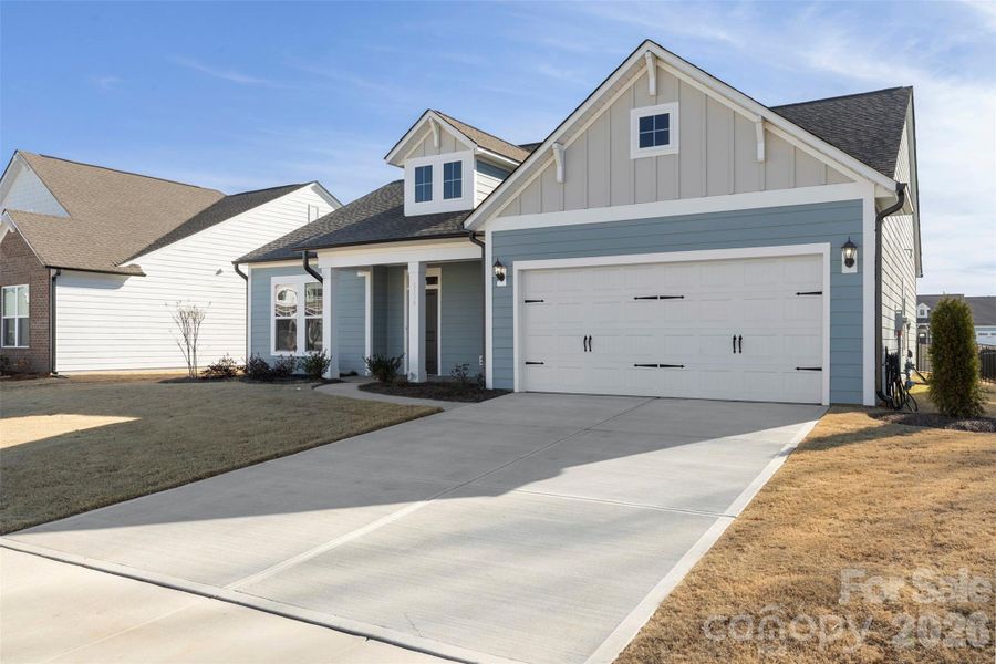 Front exterior of a new home in Encore at Harmony, Harrisburg, NC, highlighting curb appeal (Image 23).
