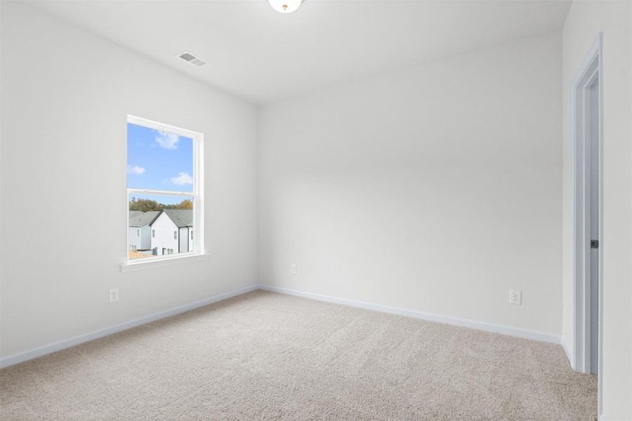 The Dove- Bedroom 2. Home under construction, photo used for illustrative purposes only, colors and options will vary.