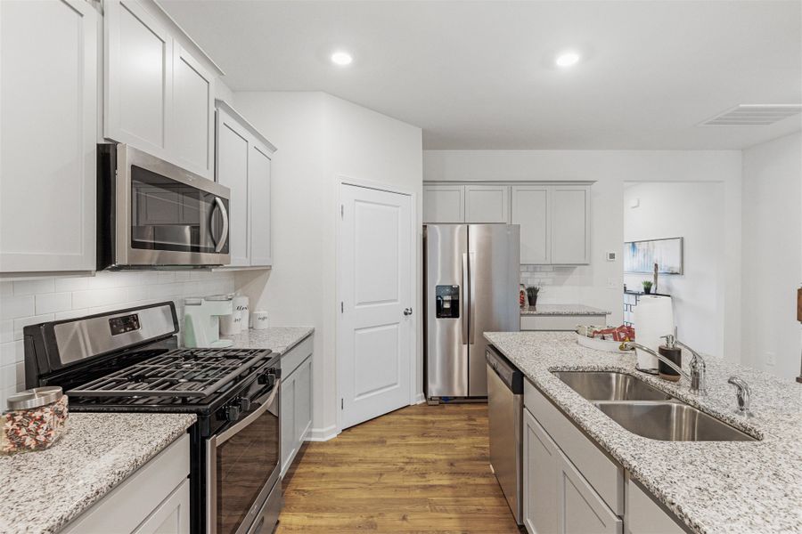 Representative furnished interior of a home built from the Hayden by D.R. Horton in Hillcrest Landing, McDonald (Image 8).