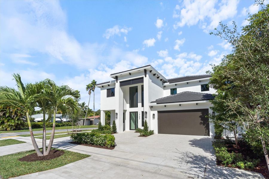 Home faces south with large circular driveway