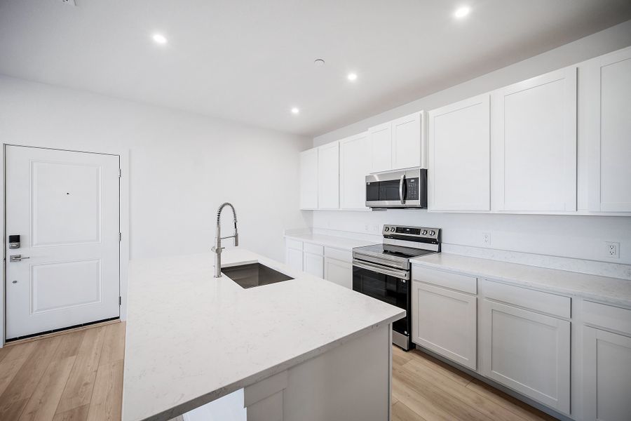 Furnished interior view inside a new home in Lyric at RidgeGate Condos, Lone Tree (Image 7).