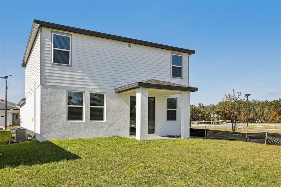 Exterior details and patio area of a home in The Reserve at Hammock Oaks - Classic Series, Lady Lake (Image 26).