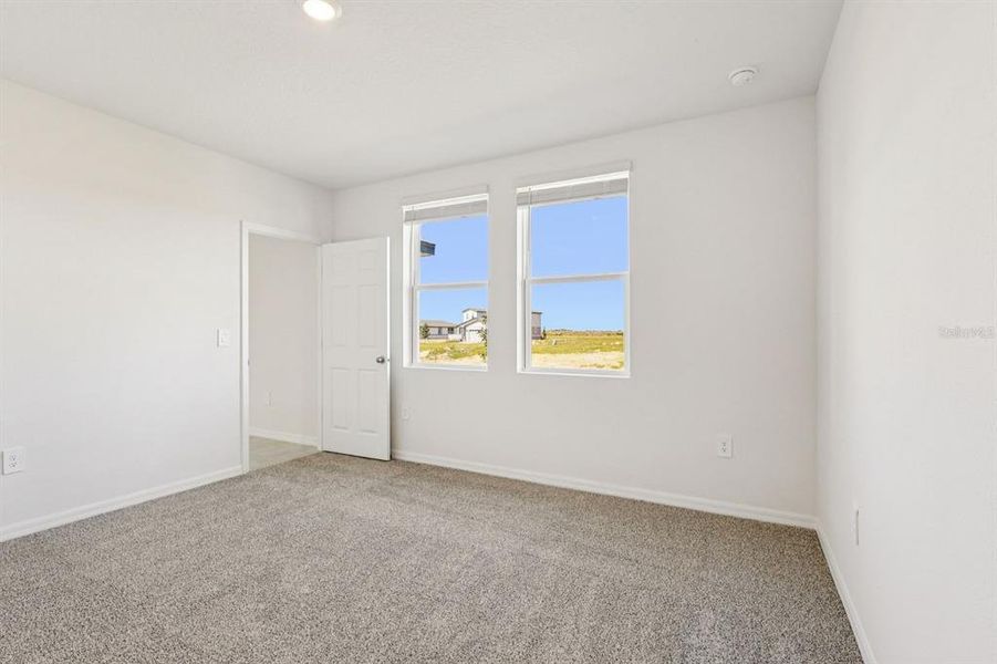 Spacious, unfurnished interior of a new home in Springs at Lake Alfred - Classic Series, Lake Alfred (Image 13).